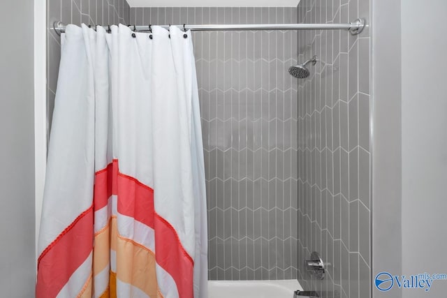 bathroom featuring shower / bathtub combination with curtain