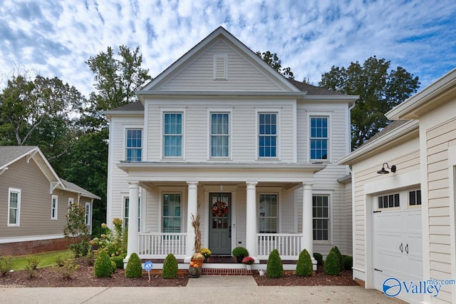 view of front of home with a garage and a porch