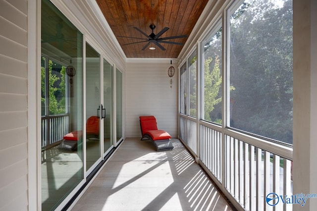 sunroom / solarium with ceiling fan and wood ceiling