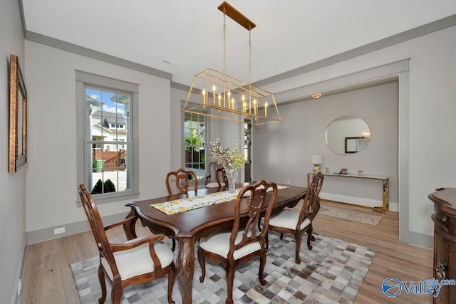 dining room featuring light hardwood / wood-style flooring and a notable chandelier