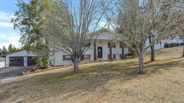 view of front of home with a garage and a front yard