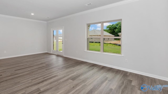14 Moon Dr, Scottsboro, AL 35769 - unfurnished room featuring plenty of natural light, wood finished floors, crown molding, baseboards, and recessed lighting