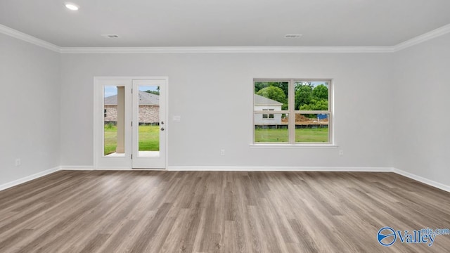 14 Moon Dr, Scottsboro, AL 35769 - spare room with healthy amount of natural light, wood finished floors, crown molding, baseboards, and recessed lighting
