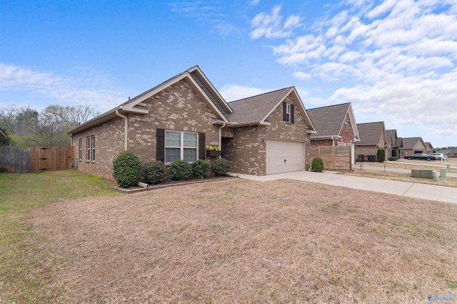 ranch-style house featuring concrete driveway, fence, brick siding, a front lawn, and a garage
