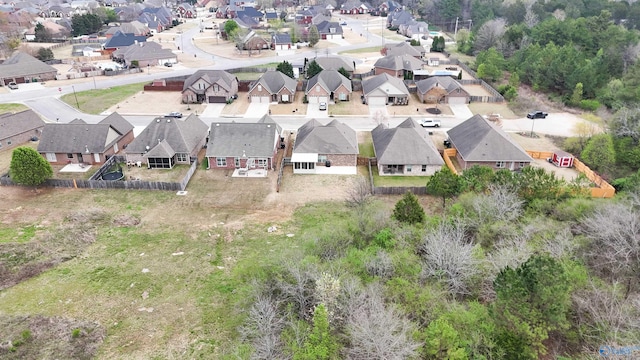 birds eye view of property with a residential view