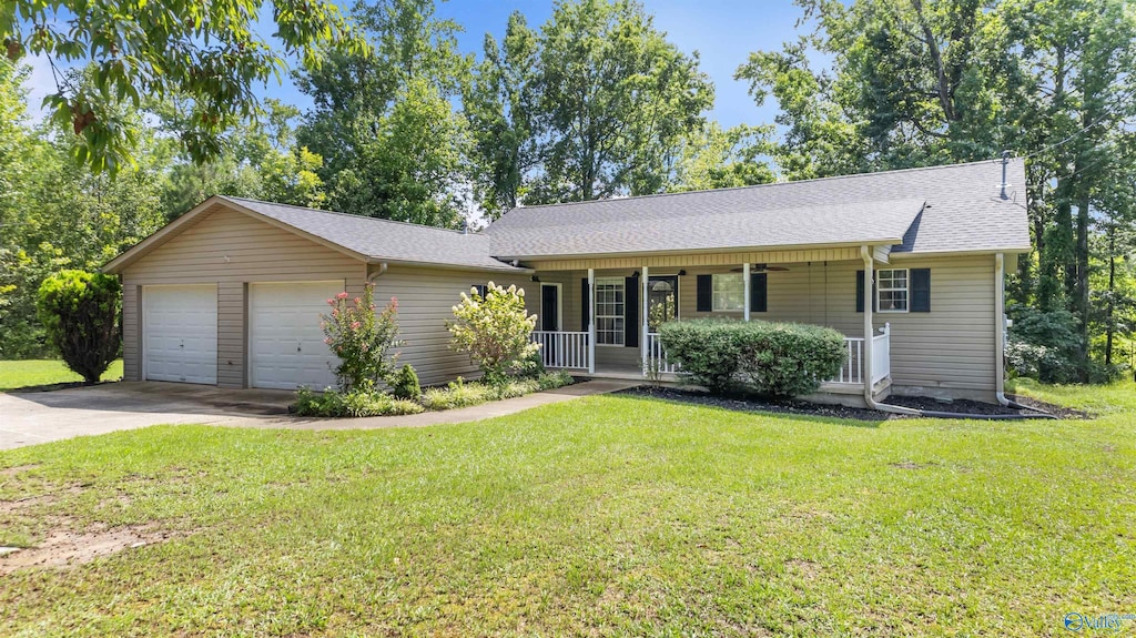 ranch-style house with a porch, a front yard, a shingled roof, and an attached garage