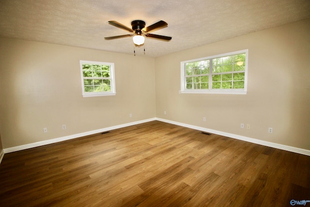 unfurnished room featuring a textured ceiling, ceiling fan, and hardwood / wood-style floors