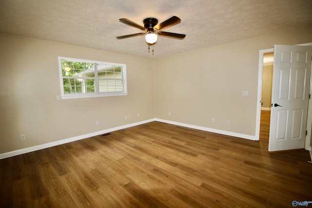 unfurnished room featuring a textured ceiling, ceiling fan, and wood-type flooring