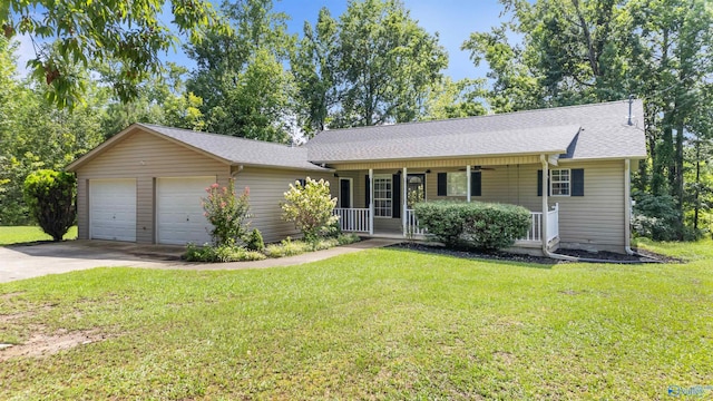 ranch-style home featuring a garage, a front yard, and covered porch