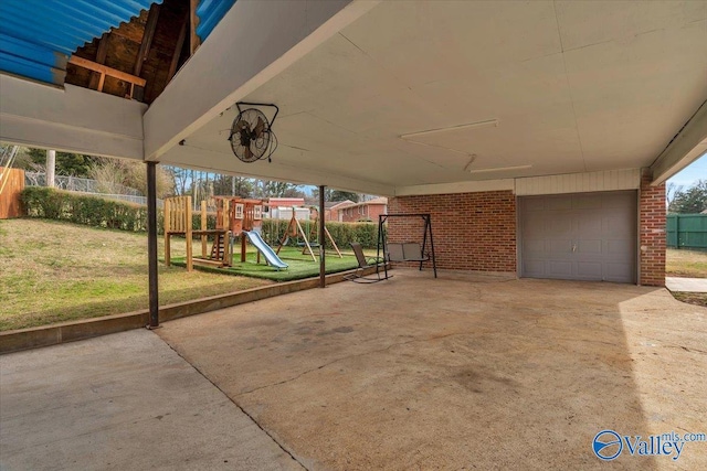 view of patio / terrace with fence and a playground