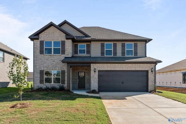 view of front of property featuring a front yard and a garage