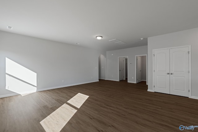 empty room featuring dark hardwood / wood-style flooring