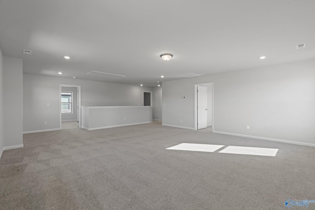 spare room with light colored carpet