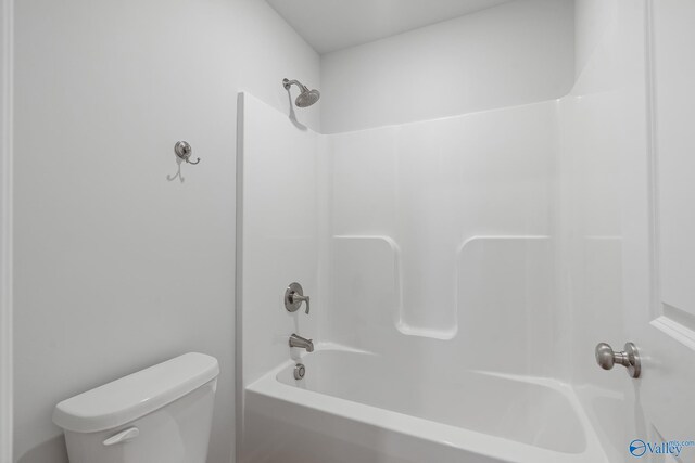 bathroom featuring toilet and shower / bath combination