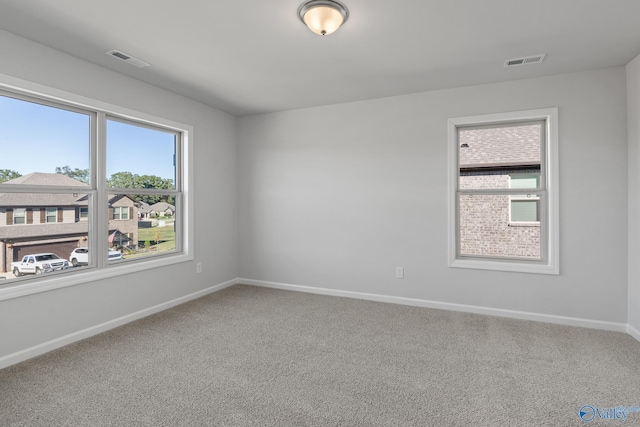 spare room featuring carpet flooring