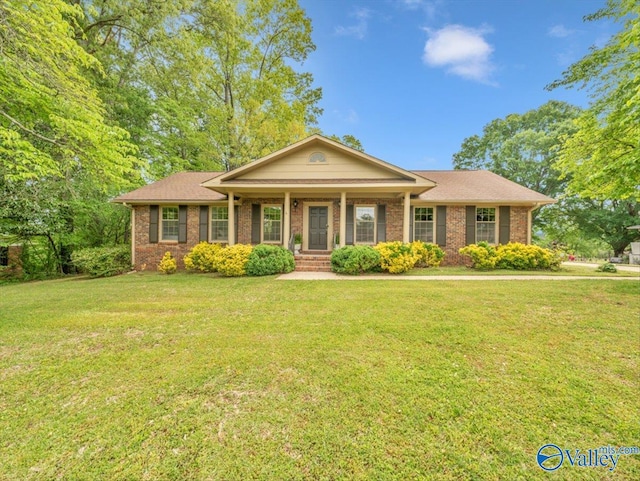 1913 Ruth St, Scottsboro, AL 35769 - single story home featuring brick siding, a front lawn, and covered porch