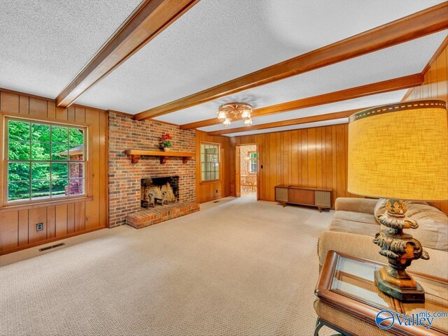 1913 Ruth St, Scottsboro, AL 35769 - living area with a textured ceiling, visible vents, and wood walls