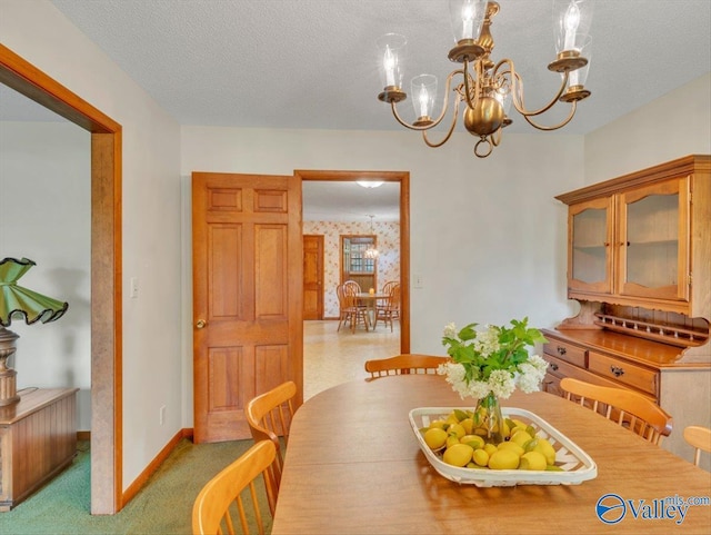 1913 Ruth St, Scottsboro, AL 35769 - dining room with carpet floors, a textured ceiling, baseboards, and an inviting chandelier