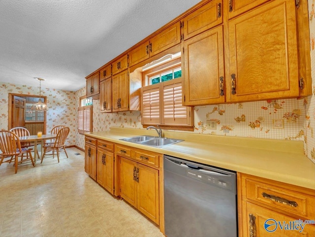 1913 Ruth St, Scottsboro, AL 35769 - kitchen featuring brown cabinetry, dishwashing machine, wallpapered walls, light countertops, and a sink