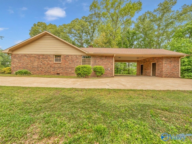 1913 Ruth St, Scottsboro, AL 35769 - ranch-style house with brick siding, a front lawn, driveway, and a chimney