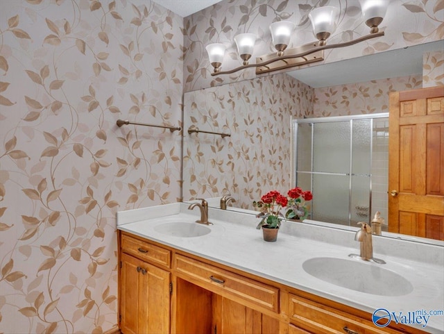 1913 Ruth St, Scottsboro, AL 35769 - full bath featuring double vanity, a sink, a stall shower, and wallpapered walls