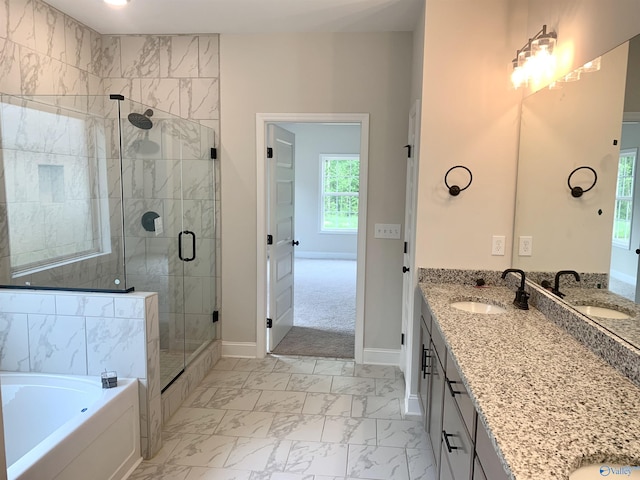 bathroom with a stall shower, baseboards, marble finish floor, and a sink