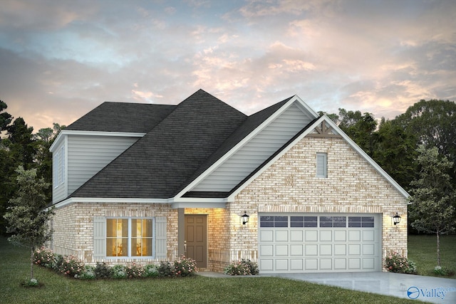 view of front property featuring a yard and a garage