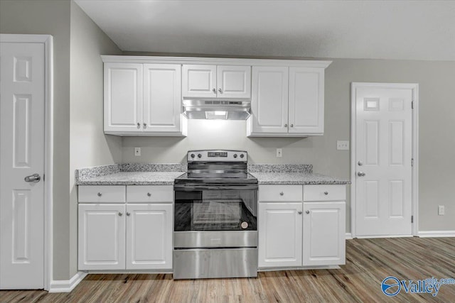 kitchen featuring white cabinets, stainless steel range with electric cooktop, and light hardwood / wood-style flooring