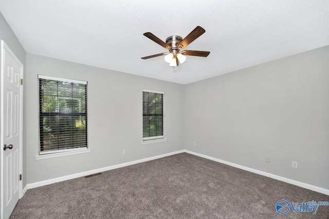 2007B Reaches Pl SW Unit B, Huntsville, AL 35802 - empty room with a ceiling fan, dark colored carpet, and baseboards