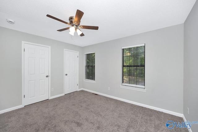 2007B Reaches Pl SW Unit B, Huntsville, AL 35802 - unfurnished bedroom featuring carpet flooring, baseboards, and ceiling fan