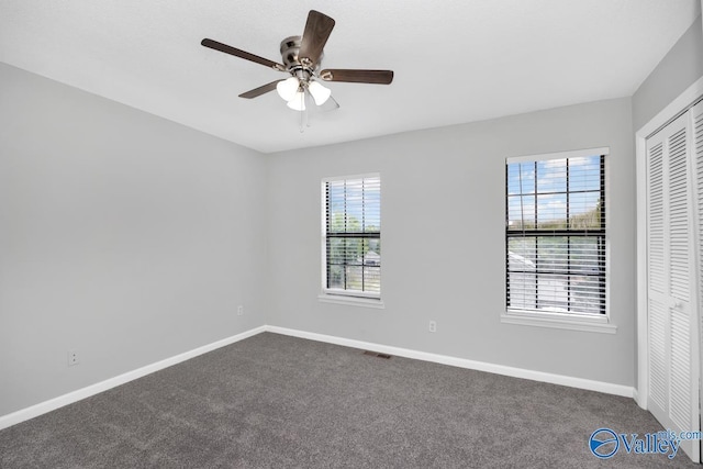 2007B Reaches Pl SW Unit B, Huntsville, AL 35802 - spare room featuring baseboards, dark colored carpet, and a ceiling fan