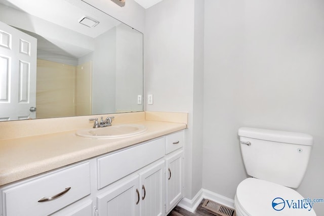 2007B Reaches Pl SW Unit B, Huntsville, AL 35802 - bathroom with toilet, vanity, baseboards, and wood finished floors