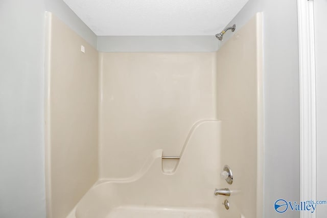 2007B Reaches Pl SW Unit B, Huntsville, AL 35802 - bathroom with a textured ceiling and washtub / shower combination