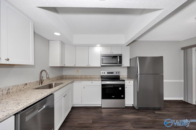 2007B Reaches Pl SW Unit B, Huntsville, AL 35802 - kitchen with appliances with stainless steel finishes, a sink, white cabinetry, dark wood-style flooring, and recessed lighting