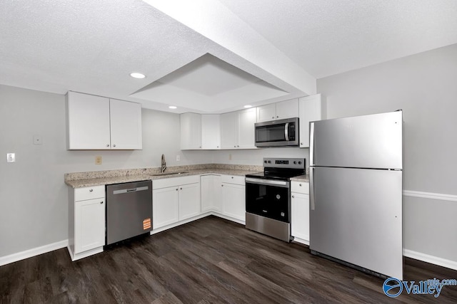 2007B Reaches Pl SW Unit B, Huntsville, AL 35802 - kitchen with stainless steel appliances, baseboards, a sink, white cabinetry, and recessed lighting