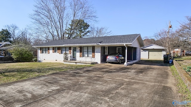 single story home featuring a shingled roof, concrete driveway, an outbuilding, crawl space, and a front lawn