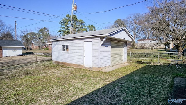 view of shed featuring fence