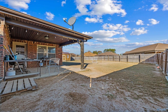 view of yard with a patio and a fenced backyard