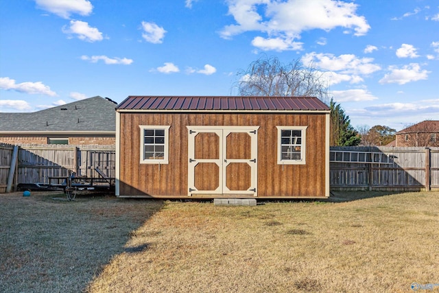 view of shed with a fenced backyard