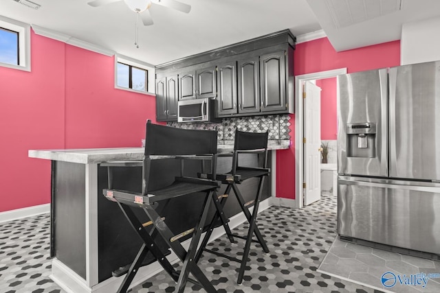 130 Kingswood Dr, Huntsville, AL 35806 - kitchen featuring stainless steel appliances, visible vents, baseboards, and a ceiling fan