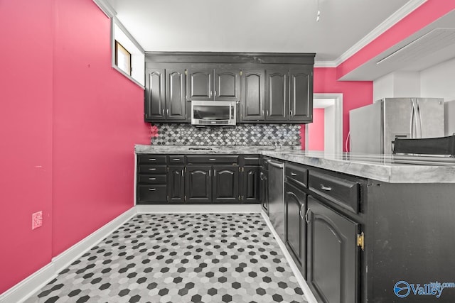 130 Kingswood Dr, Huntsville, AL 35806 - kitchen with baseboards, light stone counters, crown molding, backsplash, and appliances with stainless steel finishes