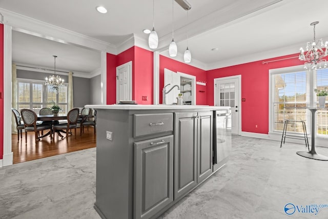 130 Kingswood Dr, Huntsville, AL 35806 - kitchen featuring decorative light fixtures, an inviting chandelier, ornamental molding, and gray cabinets