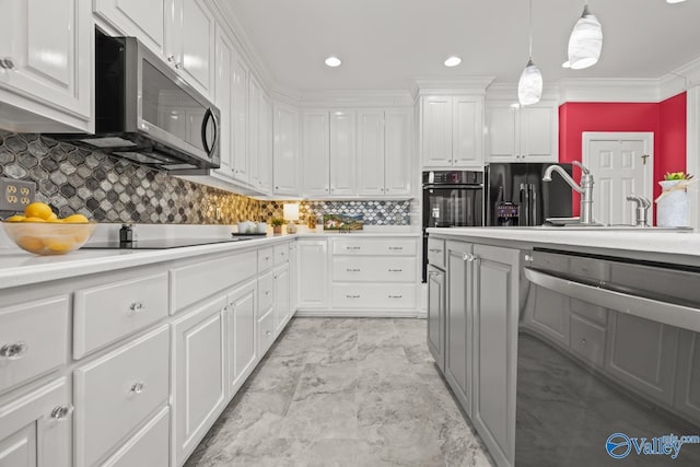 130 Kingswood Dr, Huntsville, AL 35806 - kitchen with light countertops, marble finish floor, black appliances, and ornamental molding