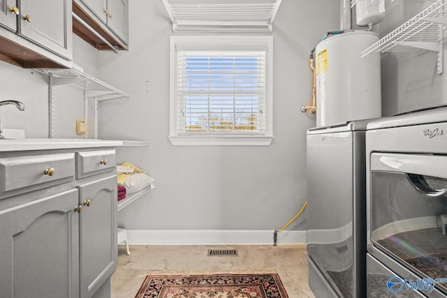 130 Kingswood Dr, Huntsville, AL 35806 - clothes washing area featuring visible vents, baseboards, a sink, cabinet space, and washing machine and dryer