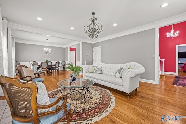 130 Kingswood Dr, Huntsville, AL 35806 - living area with baseboards, an inviting chandelier, crown molding, recessed lighting, and wood finished floors