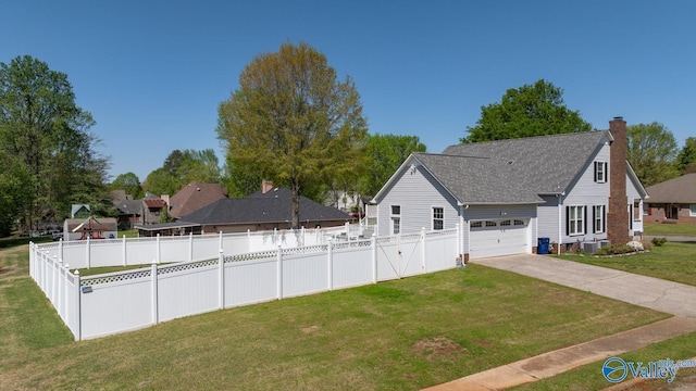 130 Kingswood Dr, Huntsville, AL 35806 - exterior space featuring an attached garage, a lawn, a chimney, fence, and driveway