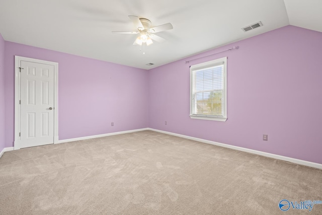 130 Kingswood Dr, Huntsville, AL 35806 - carpeted spare room featuring visible vents, ceiling fan, vaulted ceiling, and baseboards