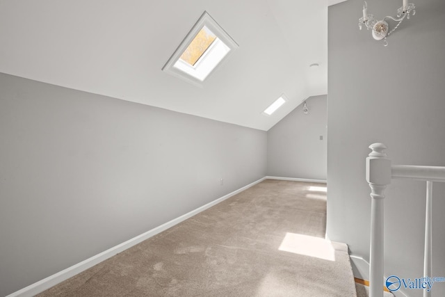 130 Kingswood Dr, Huntsville, AL 35806 - additional living space featuring carpet, baseboards, and vaulted ceiling with skylight