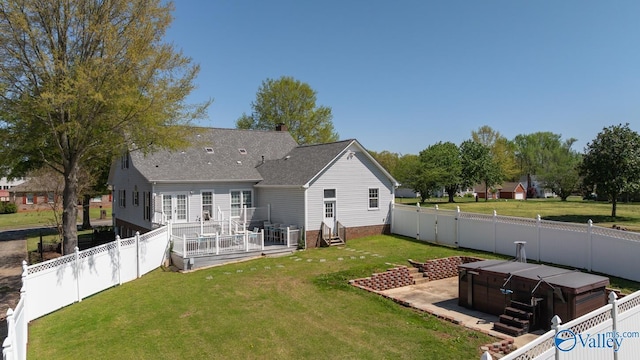 130 Kingswood Dr, Huntsville, AL 35806 - rear view of house featuring entry steps, a fenced backyard, a lawn, and a hot tub
