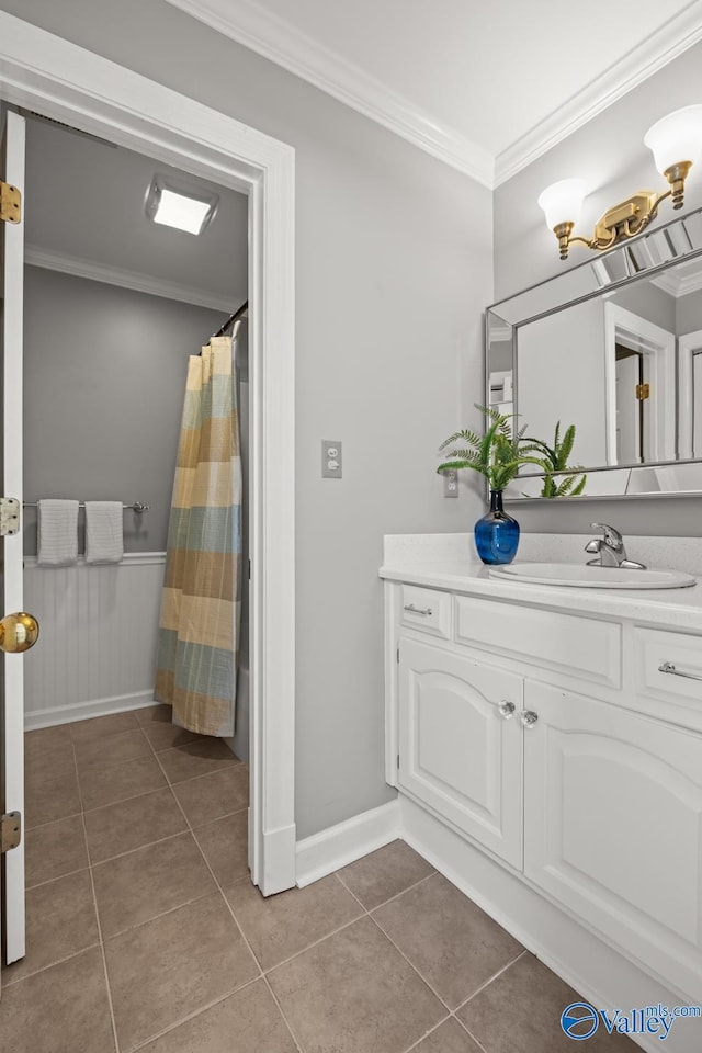 130 Kingswood Dr, Huntsville, AL 35806 - full bath featuring crown molding, vanity, tile patterned flooring, a wainscoted wall, and baseboards